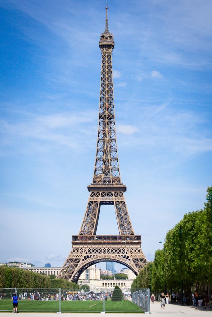 Capture of the iconic Eiffel Tower in Paris, France, under a clear blue sky.