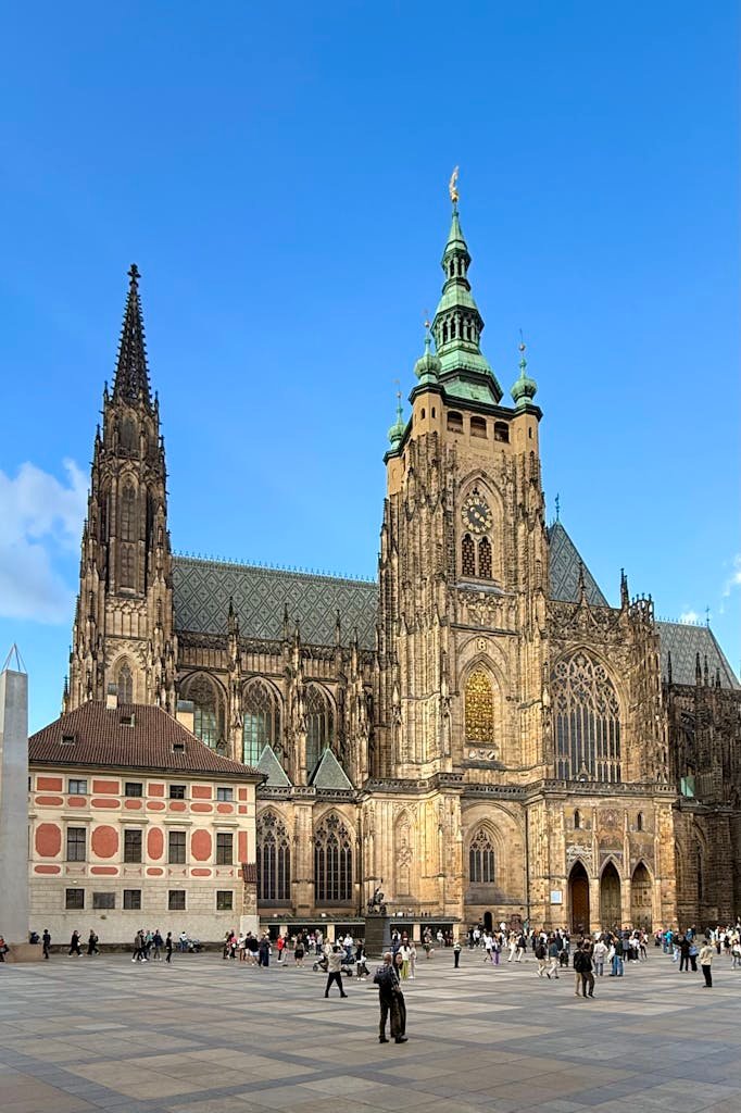 Stunning view of St. Vitus Cathedral under a clear blue sky in Prague, showcasing Gothic architecture.